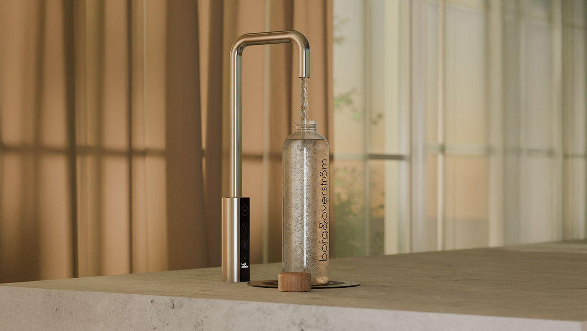 Borg & Overström tap filling a branded glass bottle