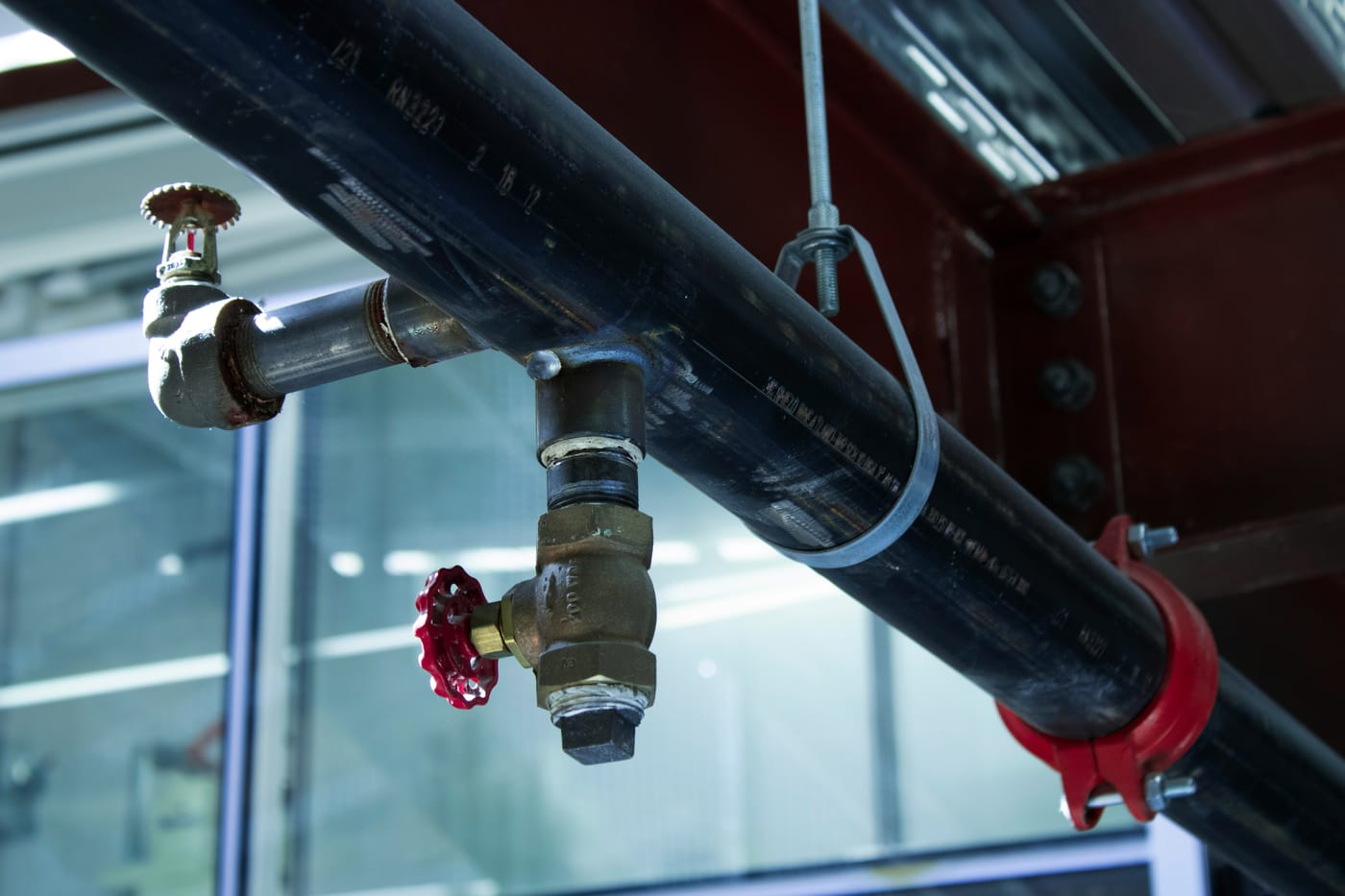 Close-up of an industrial pipe valve and fittings